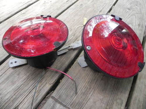 (2) pair of round tail lights and mounts as pictured