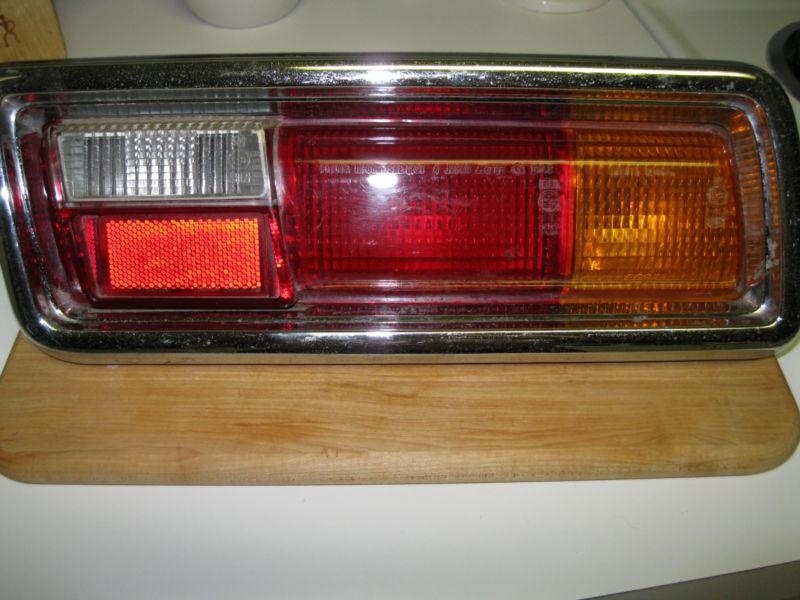 1975-1979 toyota corolla right tail light assembly - lens housing bezel 