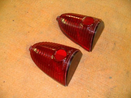 A pair of nos guide 1955 chevy tail light lenses